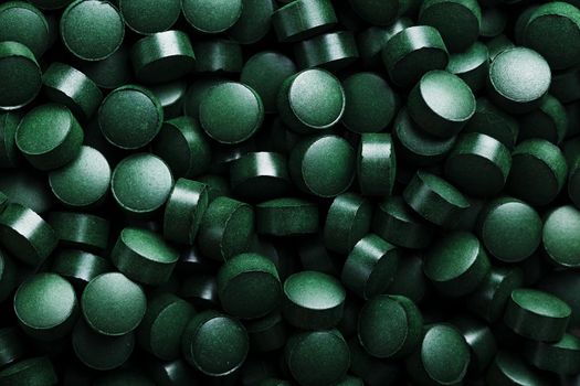 Close-up of Green tablets of organic spirulina