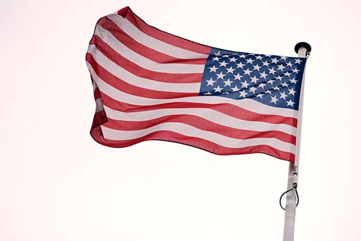 Representing the United States. Shot of the flag of the United States of America blowing in the wind.