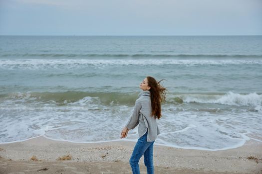 cheerful woman sand beach walk ocean freedom travel Happy female relaxing. High quality photo