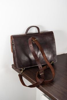 back view of a brown leather briefcase with antique and retro look for man
