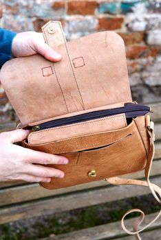 close-up photo of yellow leather handbag