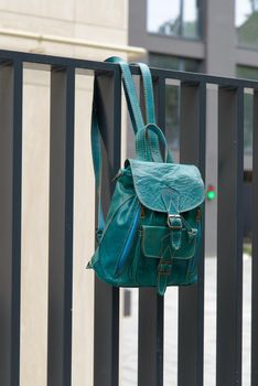 Tiffany leather backpack on the metal fence