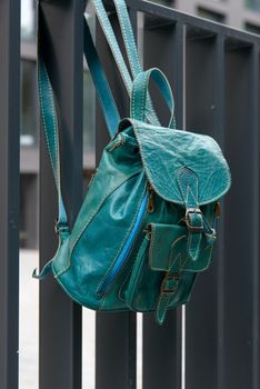 Tiffany leather backpack on the metal fence