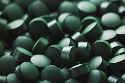 Close-up of Green tablets of organic spirulina