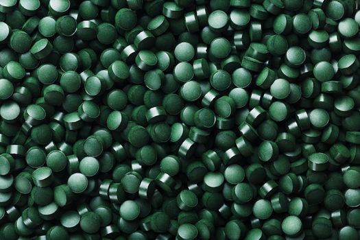 Green tablets from spirulina vegetarian dietary supplement