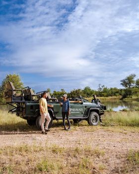 South Africa The Klaserie Private Nature Reserve February 20222, luxury safari car during a game drive, couple men and woman on safari in South Africa.