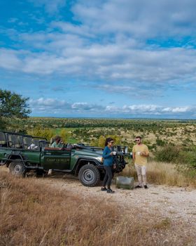 South Africa The Klaserie Private Nature Reserve February 20222, luxury safari car during a game drive, couple men and woman on safari in South Africa.