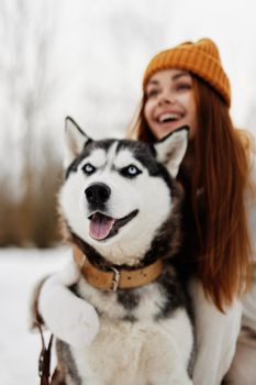 woman with dog winter landscape walk friendship winter holidays. High quality photo