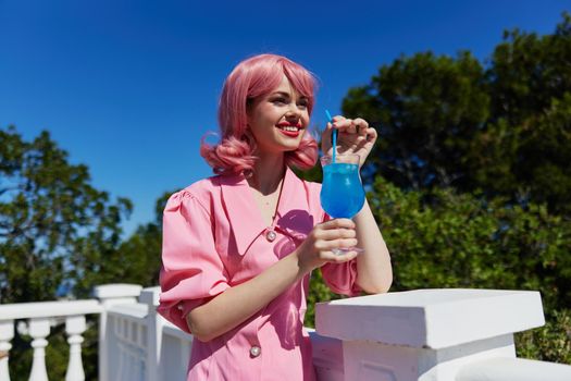 glamorous woman with pink hair summer cocktail refreshing drink Summer day