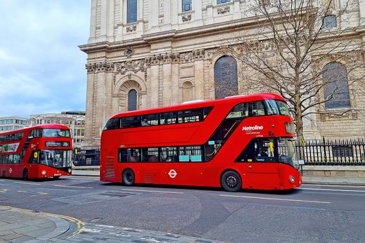 London, United Kingdom, February 4, 2022: the famous red double-decker buses drive through the streets of London