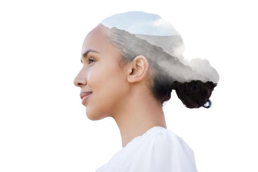 Shot of a beautiful young woman with a mountain superimposed over her face against a white background.