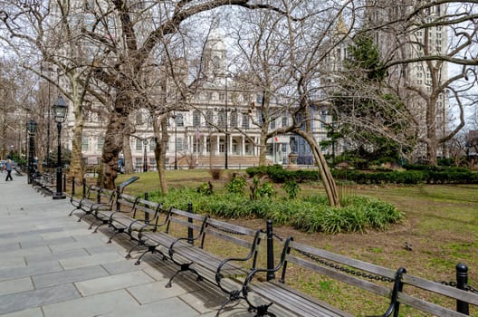 New York City Hall with Public Park and benches in forefront during Winter
