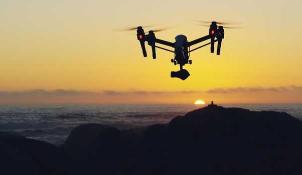 Flying away into the sunset. Shot of a drone flying outdoors.