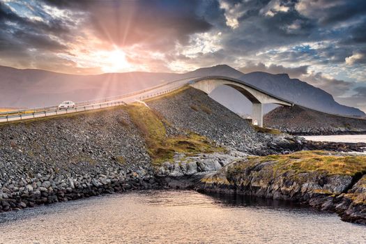 Atlantic Road Bridge with sunset and sun flare in norway