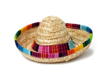 miniature straw sombrero on a white isolated background