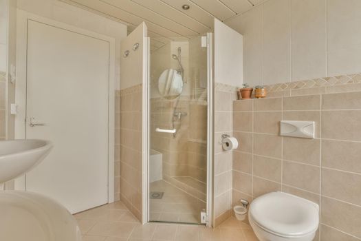 Bathroom interior with beige tiles
