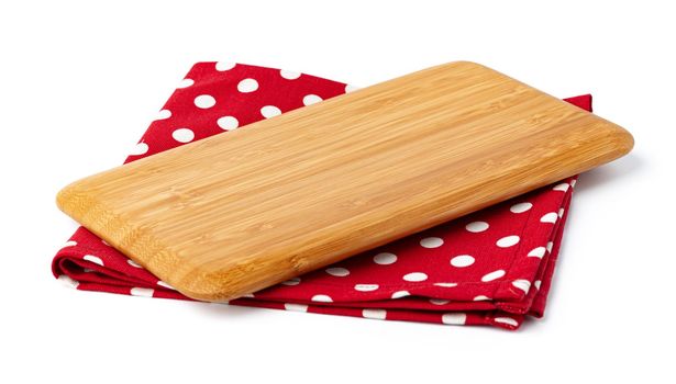 Wooden board and tablecloth isolated on white