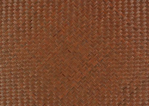 Weaving with a zigzag pattern of brown color close-up