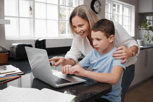I think we need to change the password. Shot of a mother and son team using a laptop to complete home schooling work.