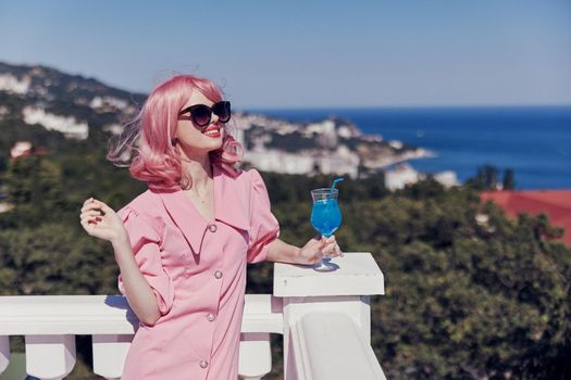 portrait of beautiful woman pink hair sunglasses leisure luxury vintage Drinking alcohol