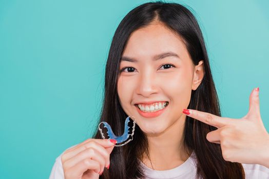 beautiful woman smiling pointing with finger silicone orthodontic retainers