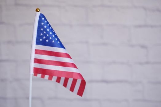 american flag against white wall