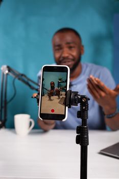 Veritical selective focus on live video podcast setup recording content creator moving hands