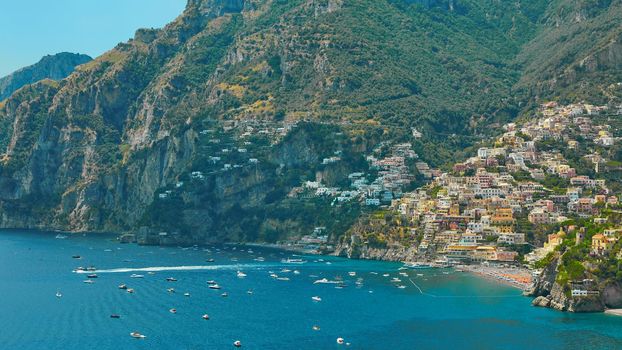 One of the best resorts of Italy with old colorful villas on the steep slope, nice beach, numerous yachts and boats in harbor and medieval towers along the coast, Positano.