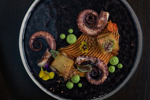 Octopus with potatoes on pea mash