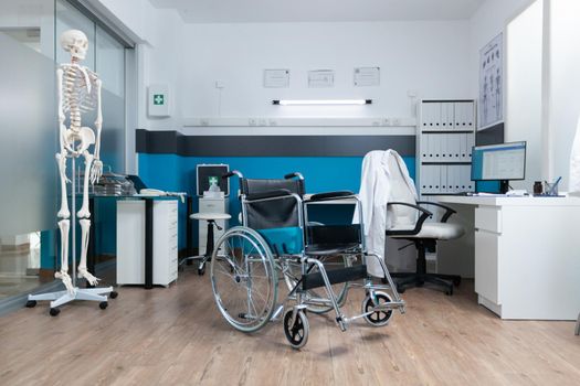 Medical wheelchair standing in empty doctor office with nobody in it