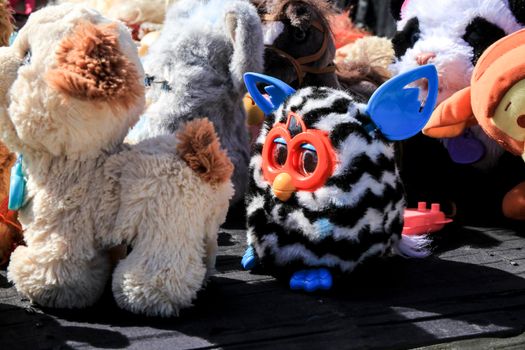 Guardamar, Alicante, Spain- April 3, 2022: Second hand stuffed animals for sale at a market stall