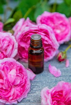 Essential oil extract of tea rose. Selective focus.