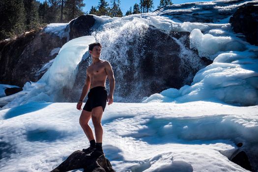 Shirtless Young Athletic Man Outdoor in Country Standing on Snow.