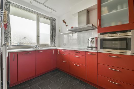 Small kitchen with red furniture