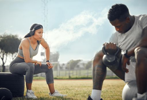 Staying healthy, together. Full length shot of a young athletic couple exercising together outdoors.