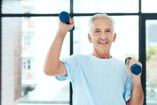 Maintaining a healthy lifestyle. Shot of a senior man working out with dumbbells.