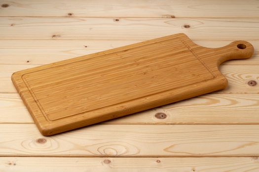Wooden board for food on wooden background