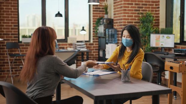 Asian women with face mask meeting at job interview application