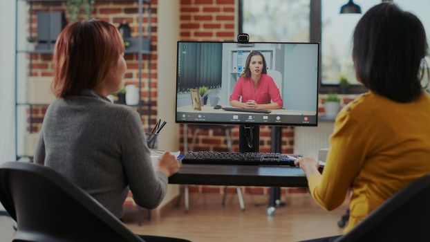 Women meeting with applicant on video call at online job interview