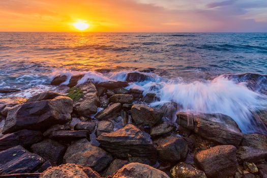 Colorful sea sunrise sky at the rocky coastline of the Black Sea
