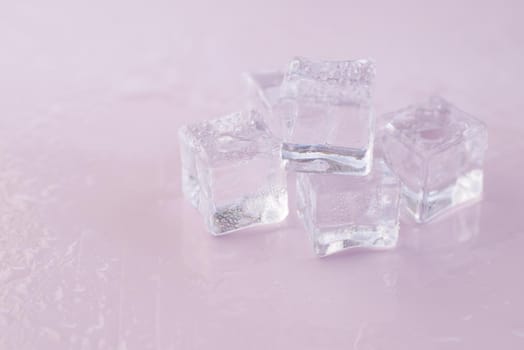 close up of many ice cubes on white background