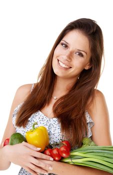 Healthy ingredients. Portrait of an attractive young woman holding a bunch of vegetables.