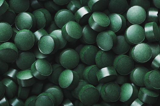 Green tablets from spirulina vegetarian dietary supplement