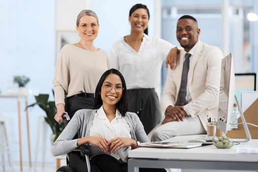 This teams going to the top. Cropped portrait of a group of diverse businesspeople smiling while gathered in their office.