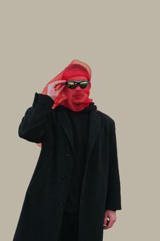 Superhero man with red mask and sunglasses fashion fighter on yellow background isolated