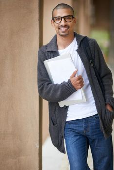 An investment in education pays the best interest. Portrait of a college student at campus.
