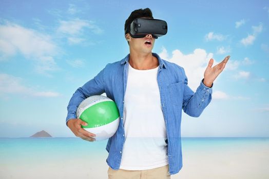 Its the getaway of my dreams. Shot of a young man wearing a VR headset superimposed over a beach landscape.