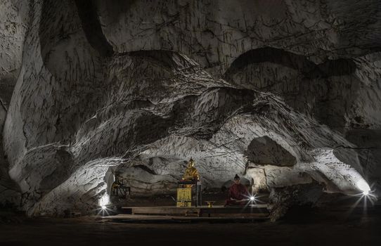 Bangkok,Thai-20 Mar,2022 : The buddha statues or The buddha image inside Wat Tham Phra Phothisat or Bodhisattva Cave Temple and it is the old and limestone cave temples at Kaeng Khoi District, Saraburi Province, Thailand, Selective focus.