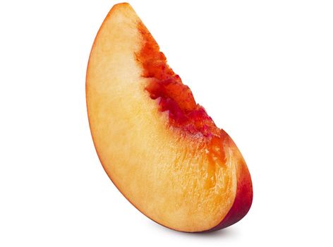 Unpitted, smooth-skinned nectarine fruit slice isolated on white background with copy space for text or images. Close-up shot.