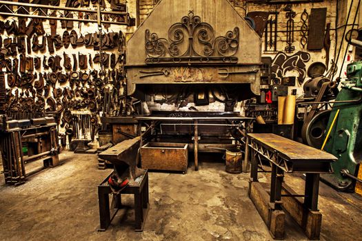 Traditional workshop for a traditional craft. Shot of a metal craftsmans workshop filled with metal tools.